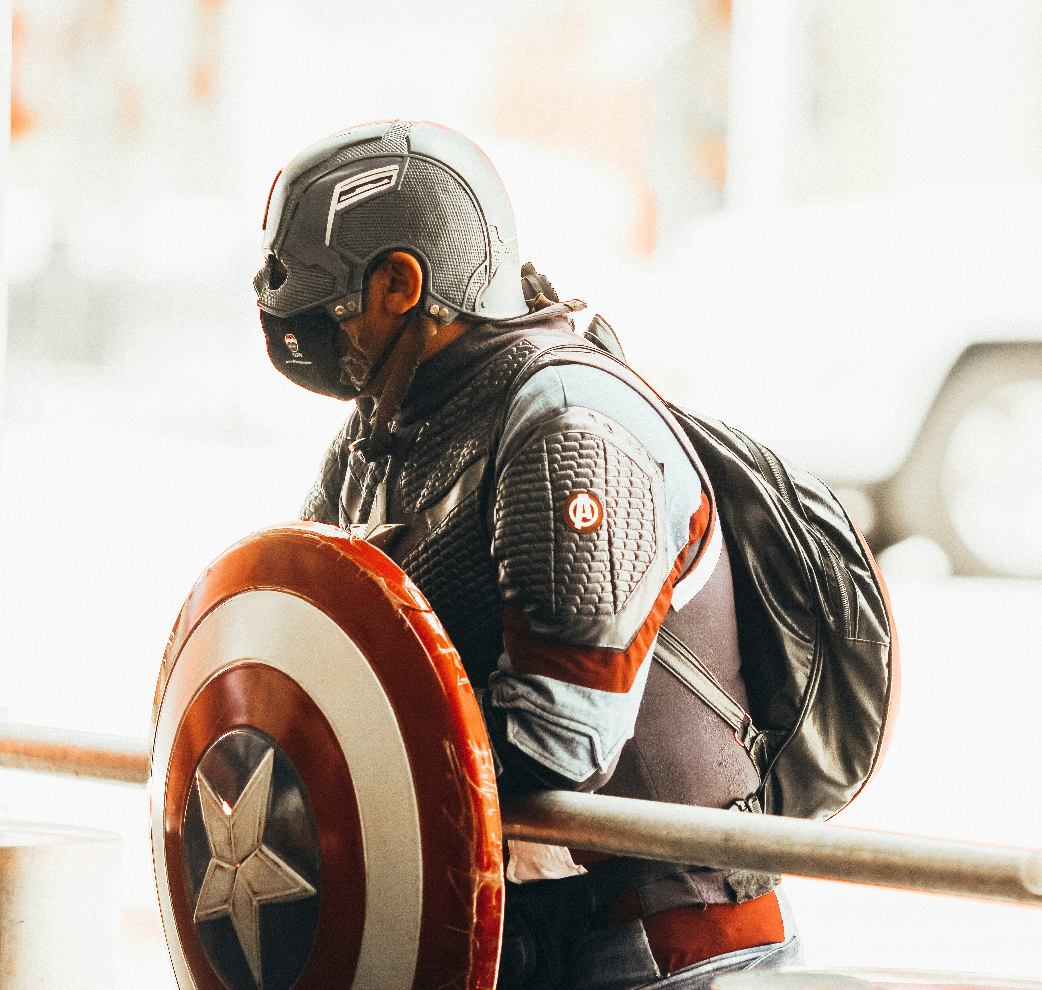 man in black helmet and helmet riding on red and black motorcycle